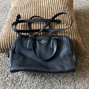 Mini Coach handbag with strap.